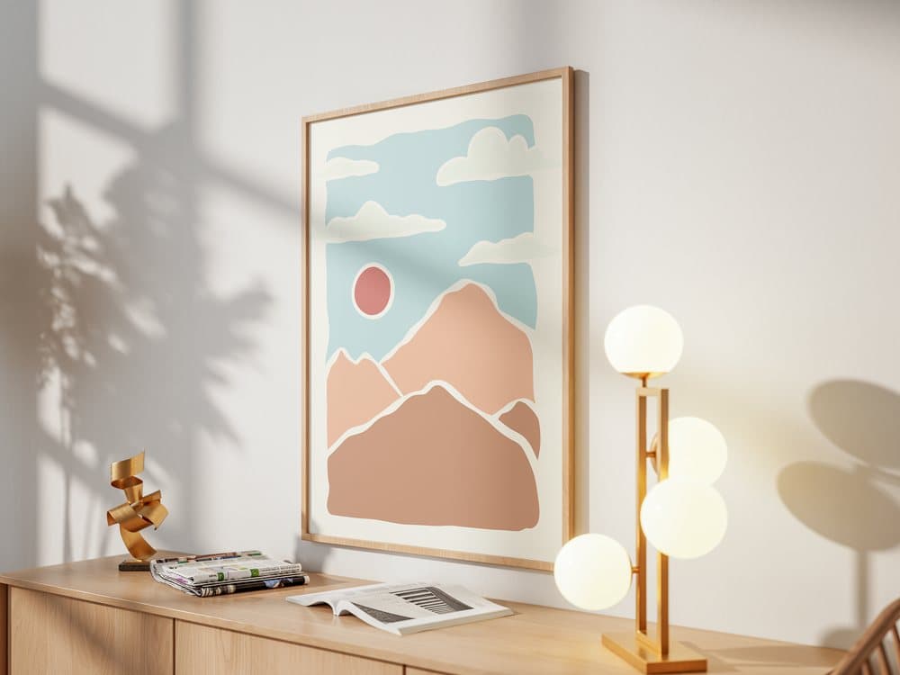 Mountain print in an oak frame on a sideboard